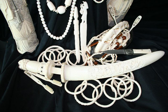 Dagger, bracelets, necklaces, sculptures, pocketknife, toothbrushes, ivory utensils and paper cutter.