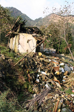 A small house in the mountains demolished after an earthquake. 